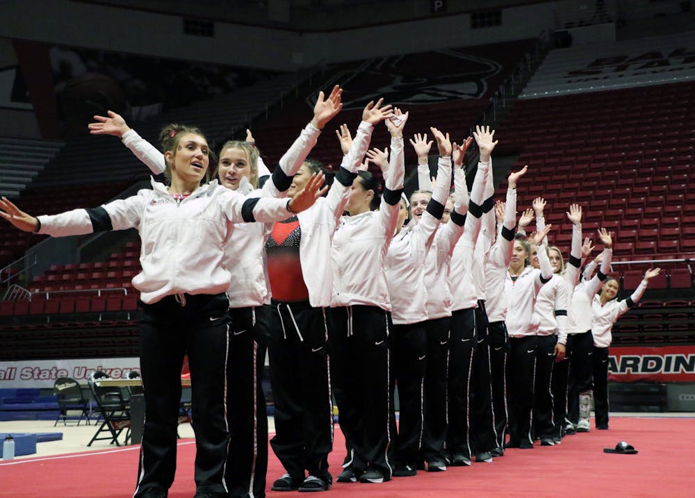 Ball State Cardinals gymnastics teams waves thank you to the crowd for attending their meet against Central Michigan Feb. 26 at Worthen Arena. The Cardinals’ winning streak reaches 11 with a 196.100-196.075 victory over the Chippewas. Madelyn Guinn, DN