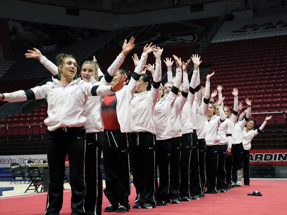 Ball State Cardinals gymnastics teams waves thank you to the crowd for attending their meet against Central Michigan Feb. 26 at Worthen Arena. The Cardinals’ winning streak reaches 11 with a 196.100-196.075 victory over the Chippewas. Madelyn Guinn, DN