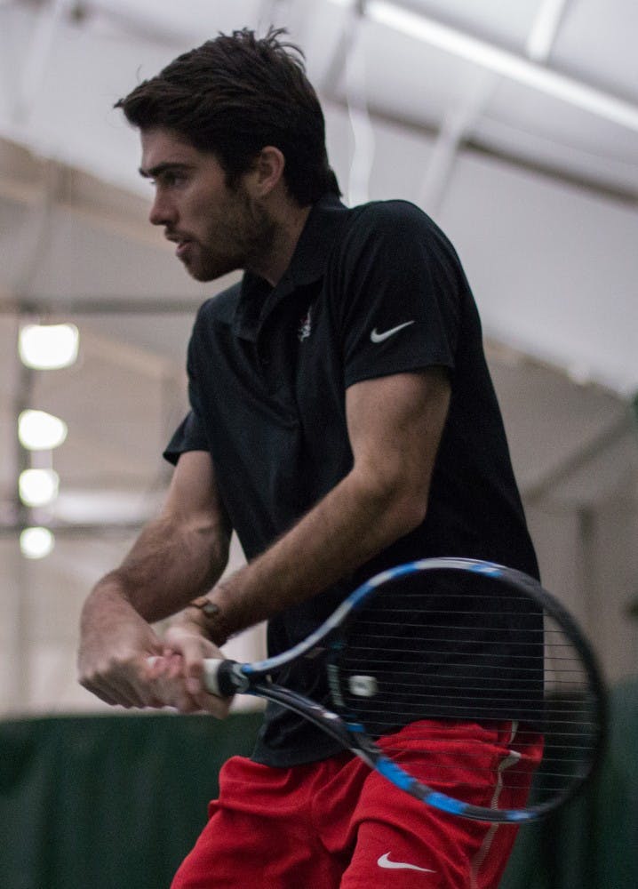 Junior Tennis player Tom Craney prepares for a hit during a singles match playing against IU Southeast Feb. 3, 2018, at the Northwest YMCA. Eric Pritchett,DN.
