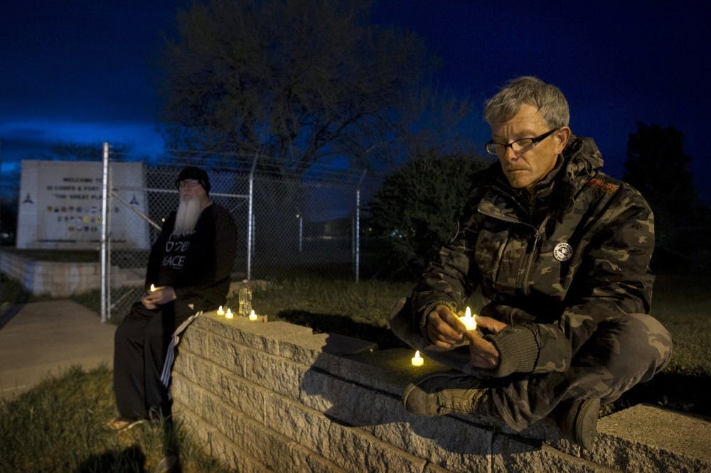 Army veteran Michael Clift participates in a candlelight vigil for the victims of the Fort Hood shooting April 4 in Killeen, Texas. A spokesman for the family of the shooter said Lopez had been angry he had only been granted 24-hour leave for his mother