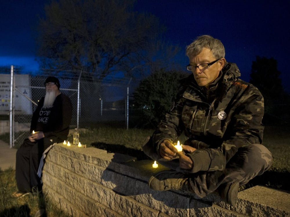 Army veteran Michael Clift participates in a candlelight vigil for the victims of the Fort Hood shooting April 4 in Killeen, Texas. A spokesman for the family of the shooter said Lopez had been angry he had only been granted 24-hour leave for his mother