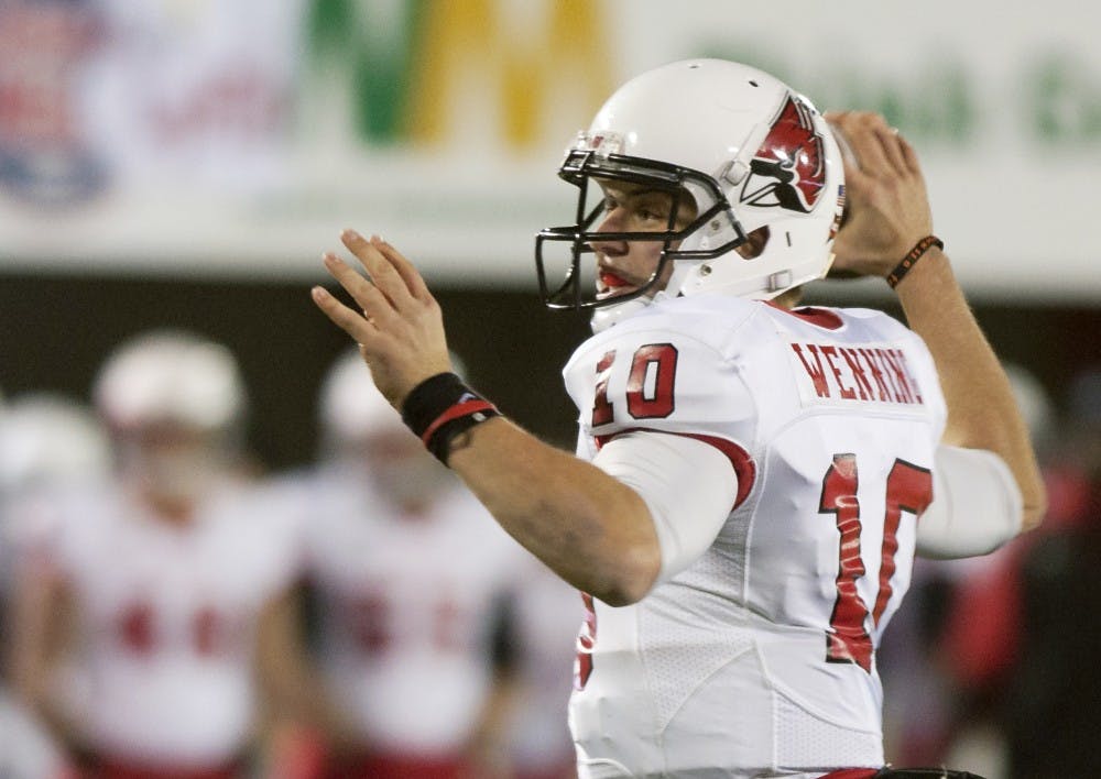 Senior quarterback Keith Wenning advances the ball upfield against Northern Illinois University on Nov. 13 at Huskie Stadium. DN PHOTO MARCEY BURTON