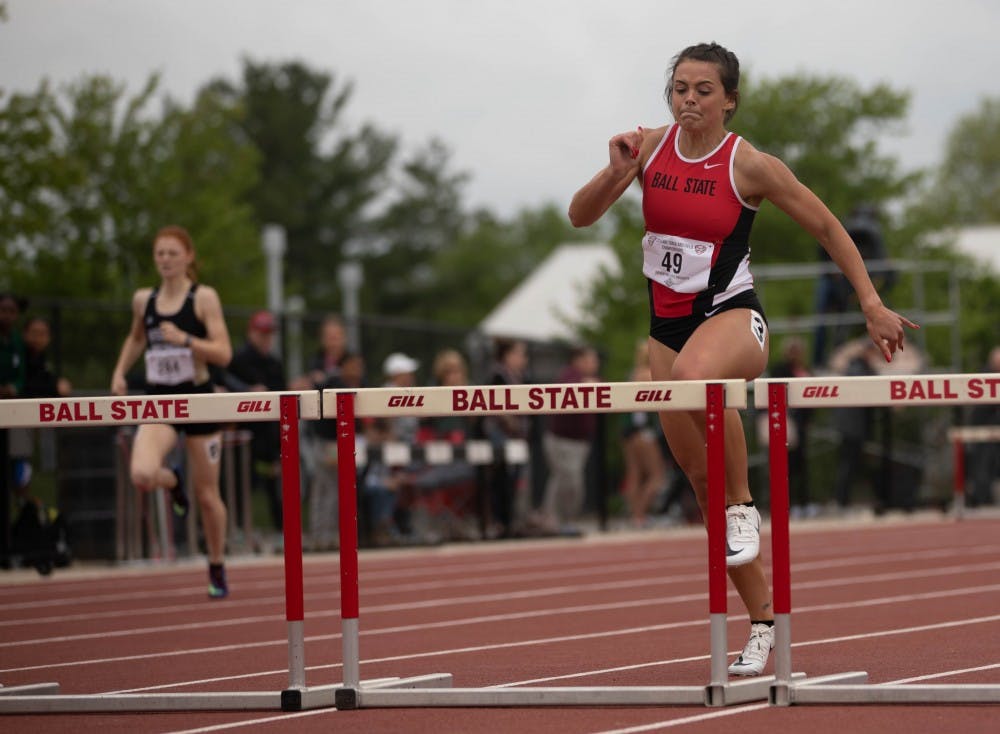 <p>Freshman Karlie Zumbro jumps over a hurdle during the &nbsp;400 meter Hurdles during the Mid-America Conference Outdoor Championships May 9, 2019. Zumbro placed 16th. <strong>Scott Fleener, DN</strong></p>