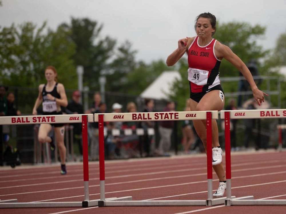Freshman Karlie Zumbro jumps over a hurdle during the &nbsp;400 meter Hurdles during the Mid-America Conference Outdoor Championships May 9, 2019. Zumbro placed 16th. Scott Fleener, DN