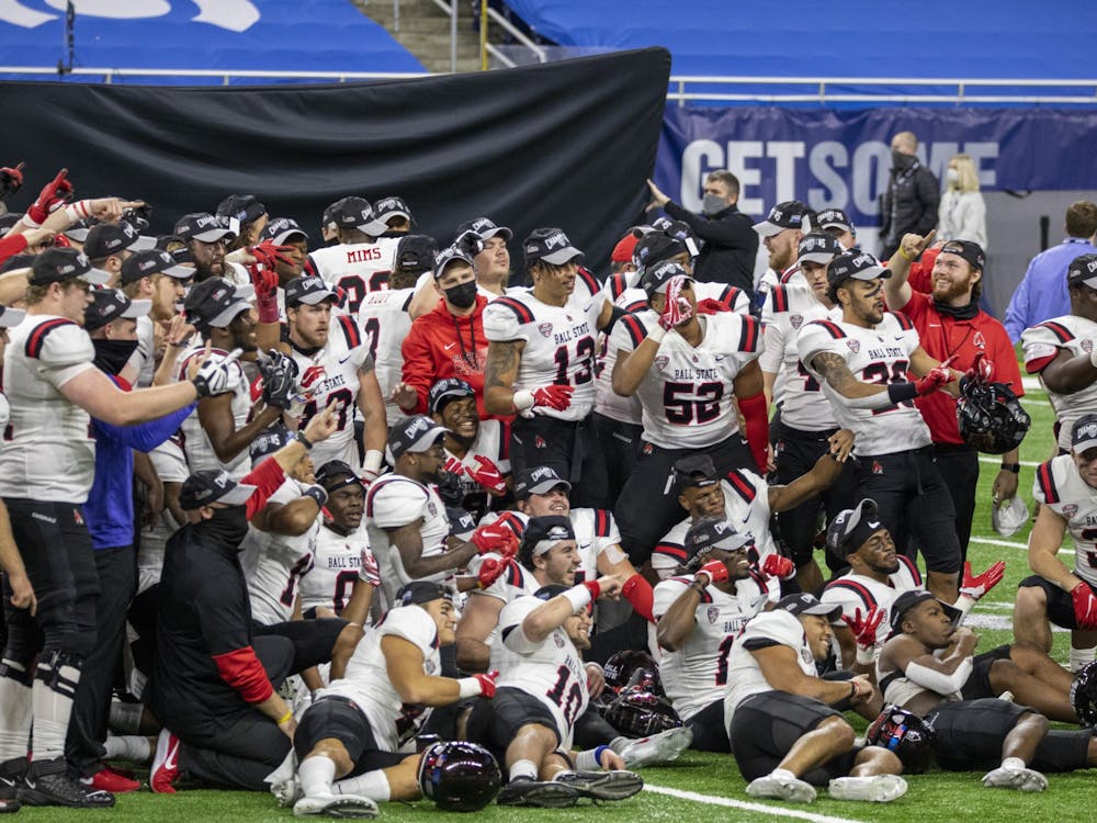 The Ball State Cardinals pose for a celebration picture after beating the University at Buffalo 38-28 in the Mid American Conference Championship Dec. 18, 2020, at Ford Field in Detroit, Mich. Jacob Musselman, DN 