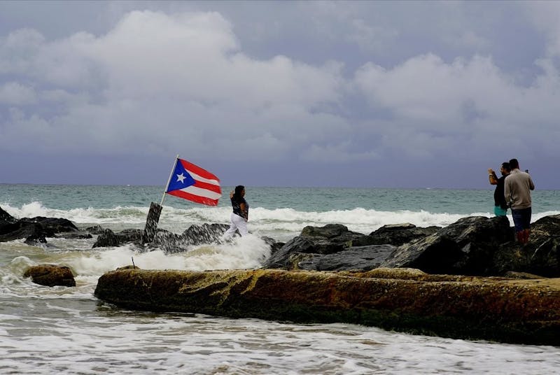 &nbsp;A woman poses for a photo backdropped by ocean waters and a Puerto Rican &nbsp;national flag, after the passing of Tropical Storm Dorian, in the &nbsp;Condado district of San Juan, Puerto Rico, Wednesday, Aug. 28, 2019. The &nbsp;Hurricane Center said the storm could grow into a dangerous Category 3 &nbsp;storm as it pushes northwest in the general direction of Florida. (AP &nbsp;Photo/Ramon Espinosa)&nbsp;