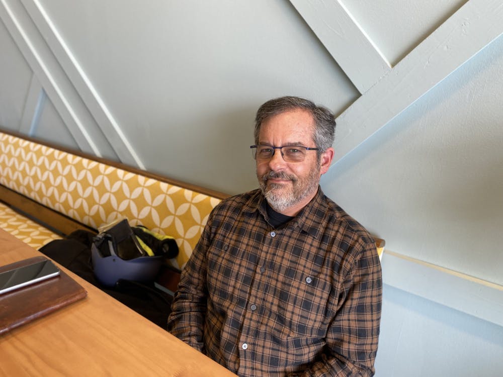 Aaron Spiegel poses for a photo inside a coffee shop in Indianapolis. Elissa Maudlin, DN