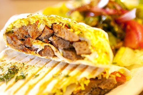 A lamb kabob plate sits in the kitchen of the Damask Café on Bethel Avenue in Muncie. The café aims to provide authentic Mediterranean food to people in the area. DN PHOTO JORDAN HUFFER