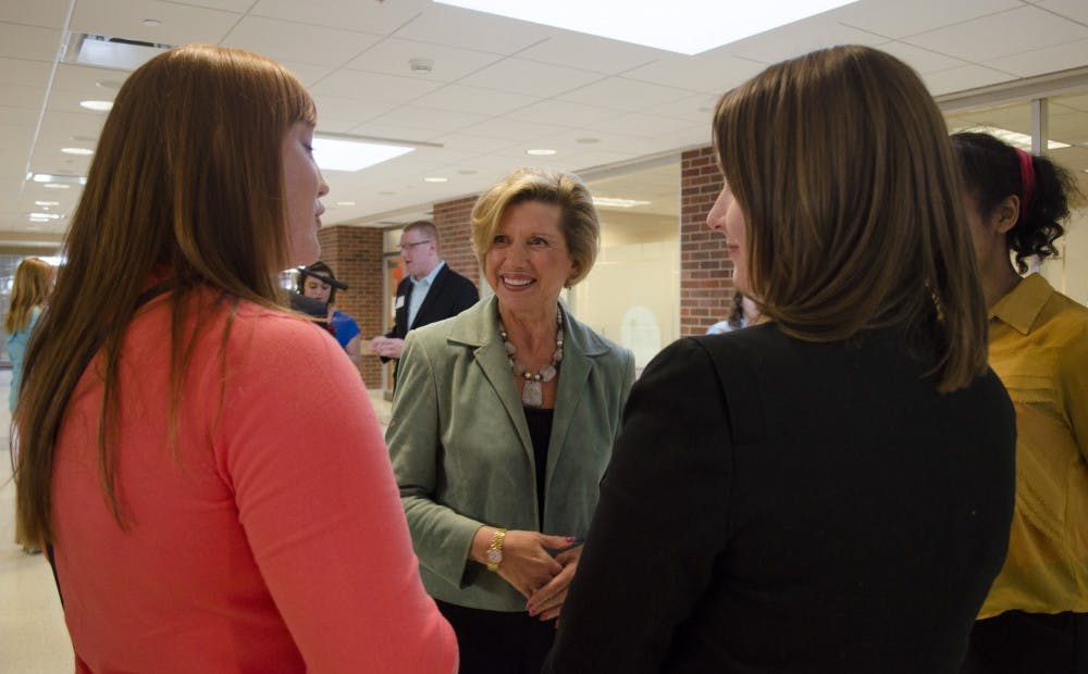 President Jo Ann Gora talks with students at the president