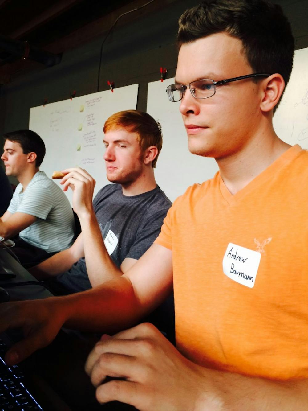 Andrew Baumann, a senior computer science major, works with his Indy Xterns team to create a map of traffic accidents May 31 at Indy Civic Hack Day. The team is composed of local interns who work and live together in Indianapolis. DN PHOTO CHRISTOPHER STEPHENS