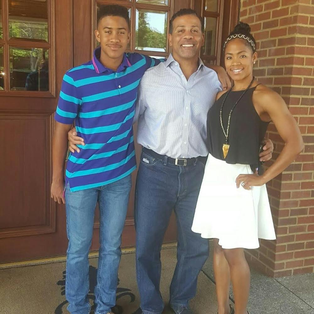 <p>Blaine Bishop stands with his wife Cella and son Chayce on Father’s Day of 2016.&nbsp;Bishop transferred to Ball State from St. Joseph's College before being drafted by the Houston Oilers in 1993. Blaine Bishop // Photo Provided</p>
