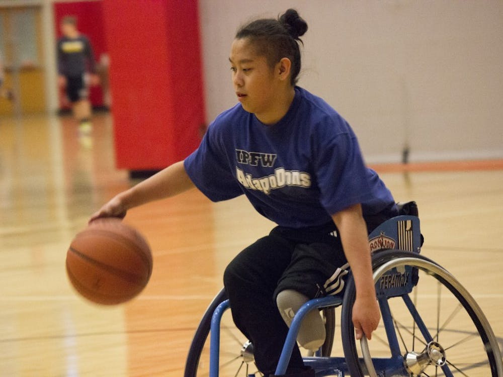 A player races down the court for a layup during a game of wheelchair basketball March 31 at the Student Recreation and Wellness Center. This scrimmage against the IPFW AdaptoDons was the team
