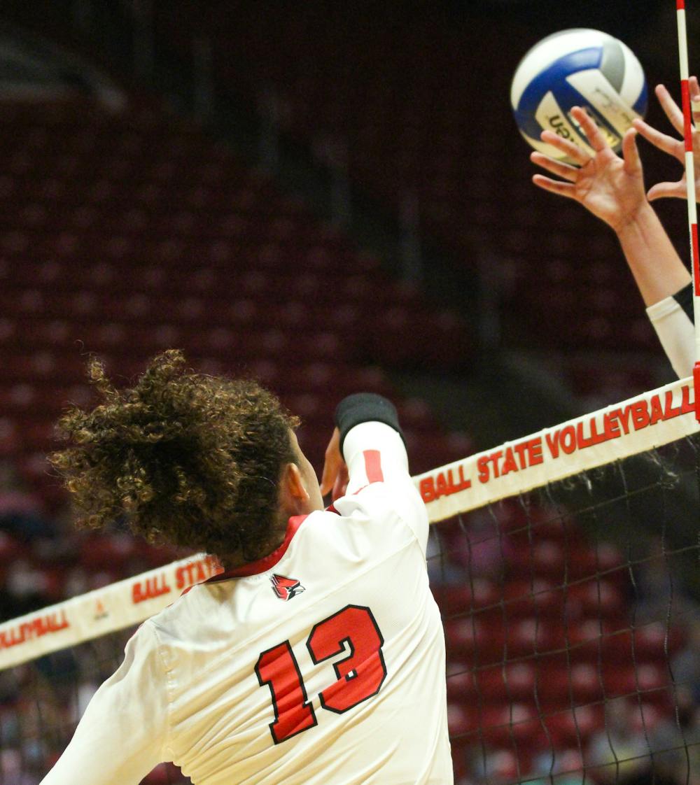 Junior outside hitter Natalie Mitchem spikes the ball past Northern Kentucky's blockers in Worthen Arena Sept. 18. The Cardinals beat out Northern Kentucky in 5 sets in the final game of the double header. Jacy Bradley, DN