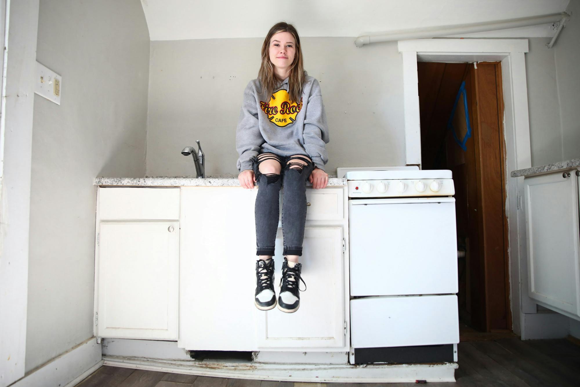 Abbi Mastagh poses for a photo in her MiddleTown Property Group rental April 18. Jacy Bradley, DN