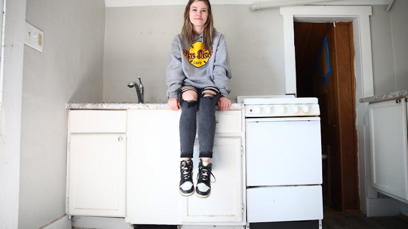 Abbi Mastagh poses for a photo in her MiddleTown Property Group rental April 18. Jacy Bradley, DN