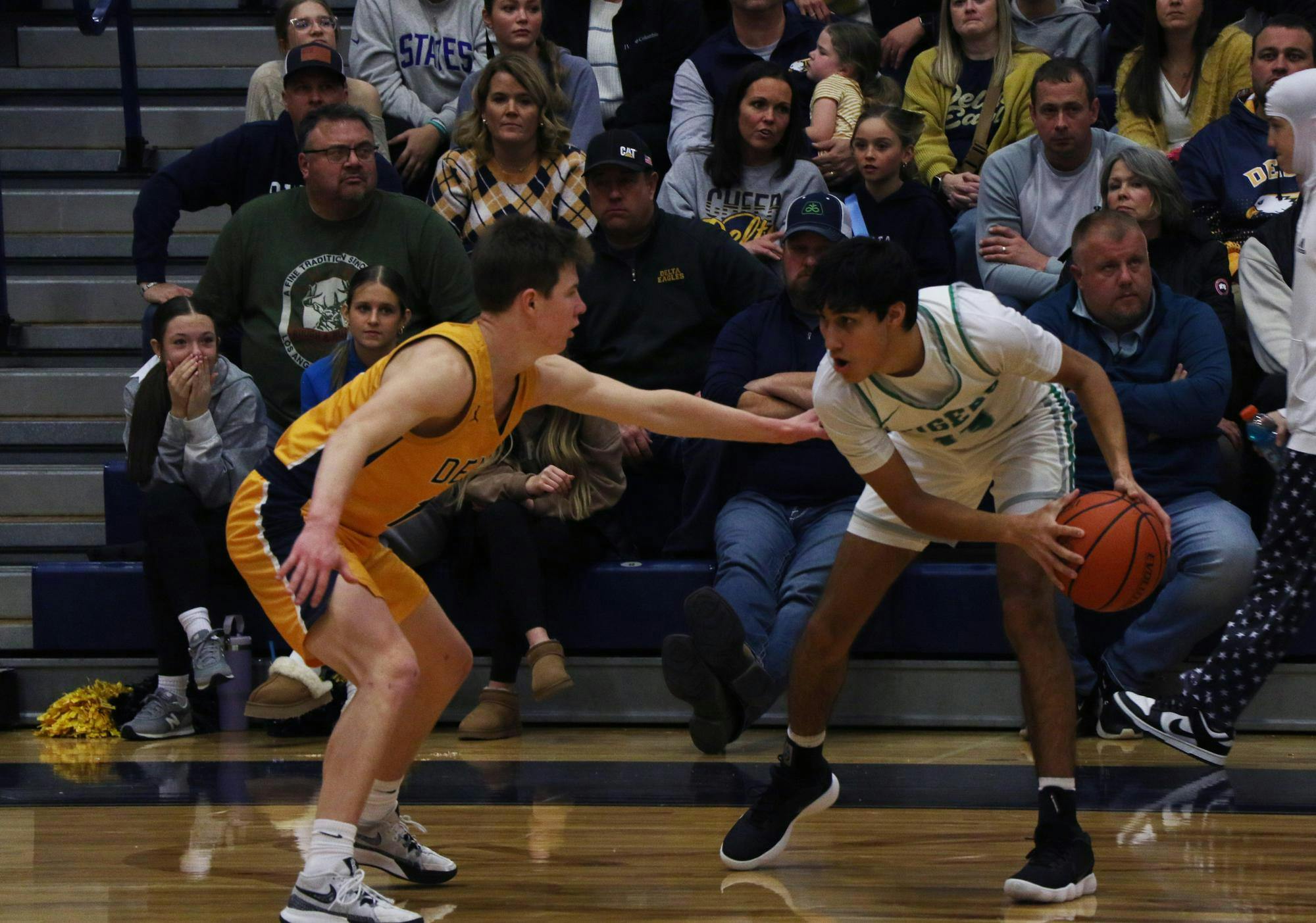 Delta senior Jonny Manor guards Yorktown junior Ephraim Daugherty Jan. 13 during the championship game of the Delaware County Tournament at Delta High School. Zach Carter, DN.