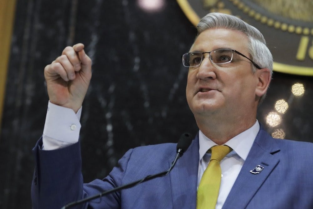 Indiana Gov. Eric Holcomb delivers his State of the State address to a joint session of the legislature at the Statehouse, Tuesday, Jan. 14, 2020, in Indianapolis. (AP Photo/Darron Cummings)