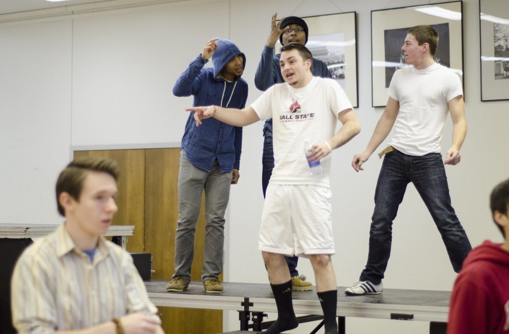 Michael Kuhn jokes around with fellow members of Note to Self before rehearsing choreography for upcoming shows this month. Members in the group say the community makes hard work worth going through. DN PHOTO COREY OHLENKAMP