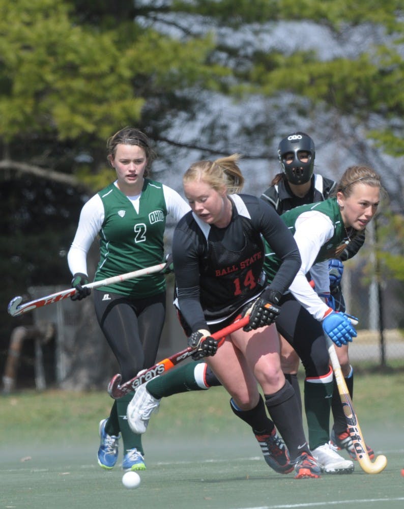 Sophomore blocker Cameron Daniels attempts to break away from Ohio University defense April 5 at the BSU Turf field. DN PHOTO TAYLOR IRBY