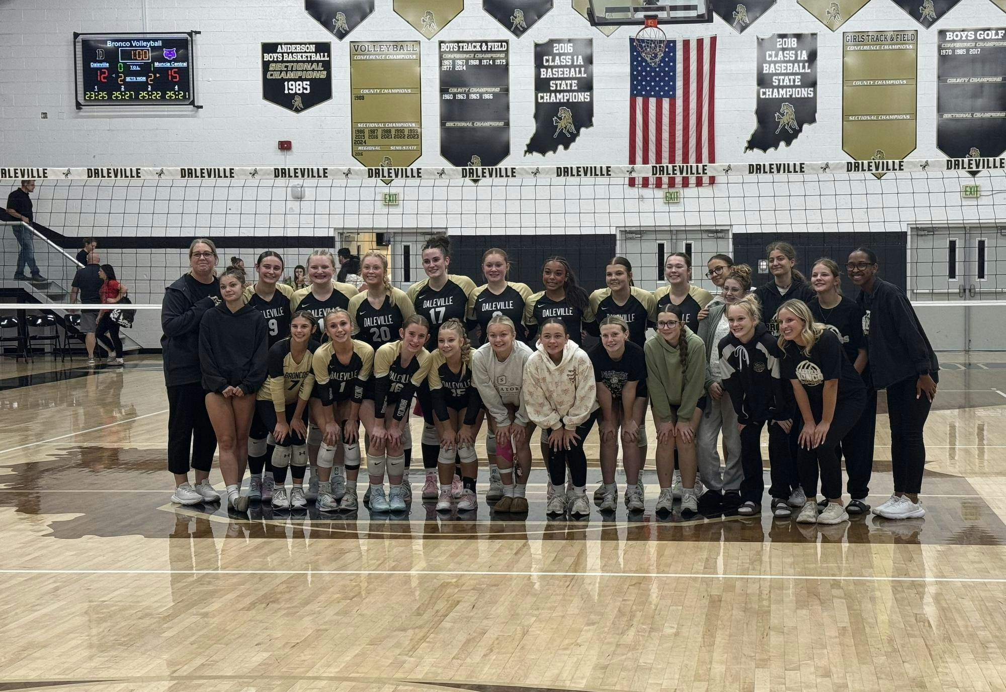 The Daleville volleyball team poses for a picture at Daleville High School on Sept. 18, 2025. The Broncos fell in their contest in five sets 2-3, nearly pulling off a reverse sweep. PHOTO BY DAVID MOORE
