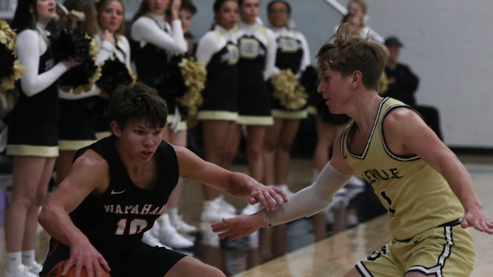 Wapahani junior Nate Luce dribbles Feb. 17 during the Raiders game against Daleville at Daleville High School. Zach Carter, DN.