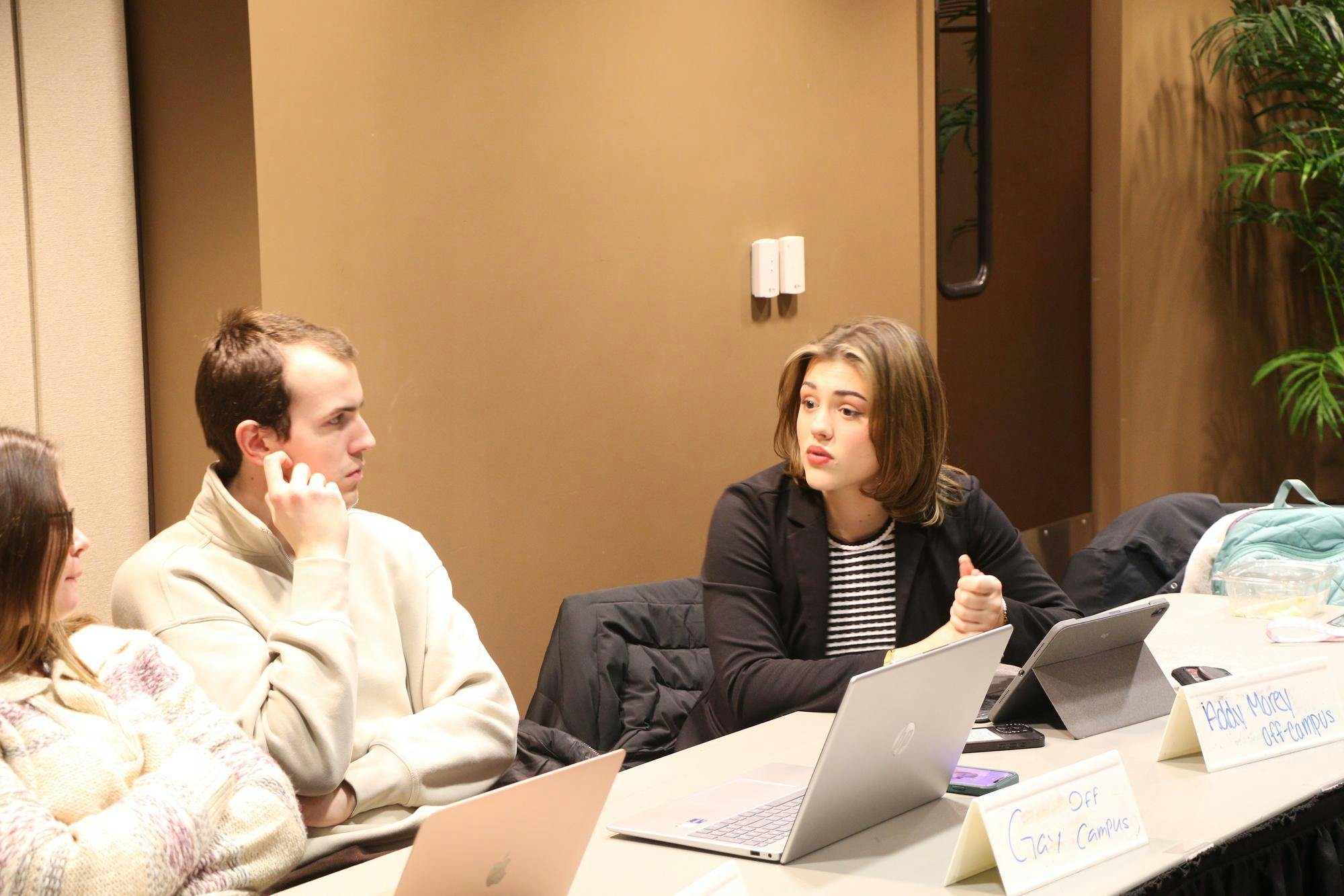 Off-campus caucus talks on what to focus on and work on. Landon Jones, DN