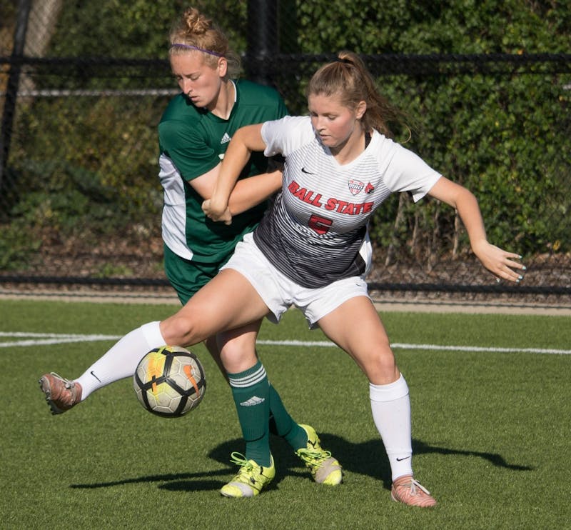 Freshman forward Greer Glover keeps possession of the ball against an Eastern Michigan player at Briner Sports Complex on Oct. 13. Rebecca Slezak, DN