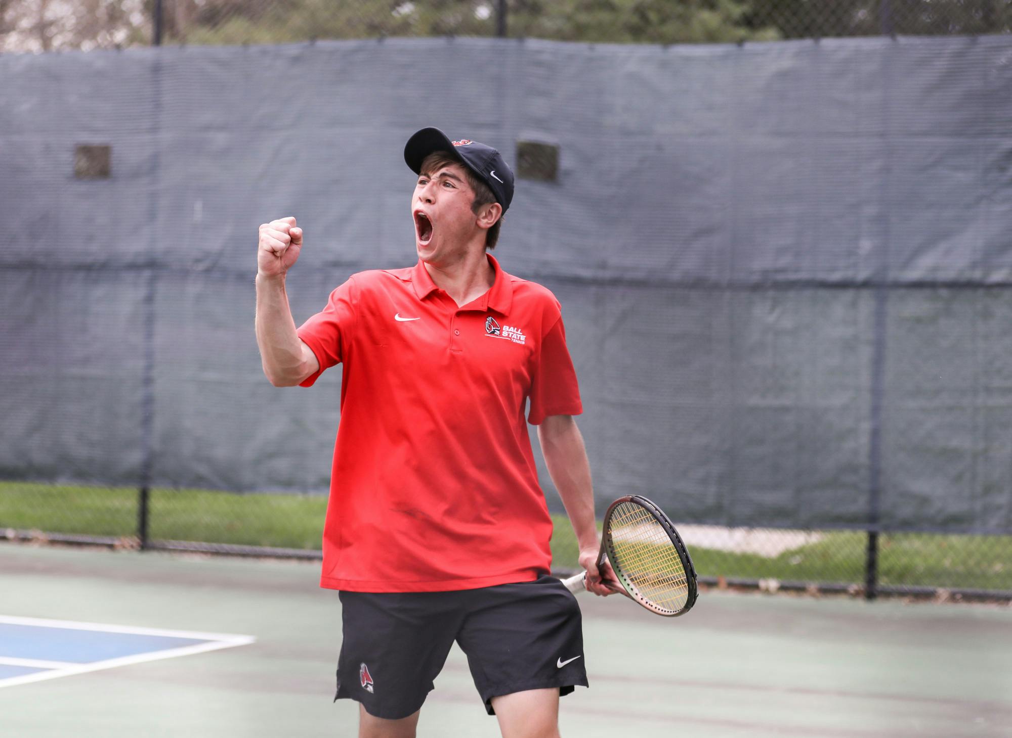 First-year Broc Fletcher celebrates after scoring point in a match against Binghamton University on April 14 at the Cardinal Creek Tennis Center. Katelyn Howell, DN.