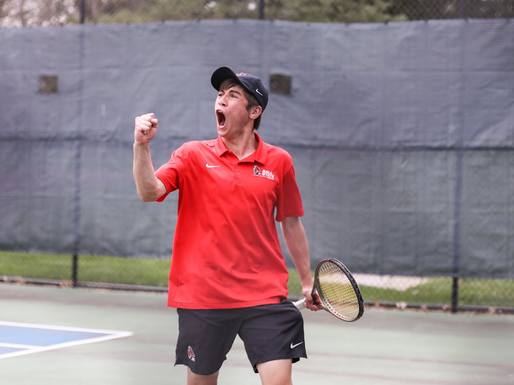 First-year Broc Fletcher celebrates after scoring point in a match against Binghamton University on April 14 at the Cardinal Creek Tennis Center. Katelyn Howell, DN.