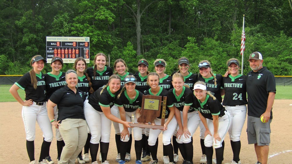 Yorktown High School Softball poses with their Regional Championship trophy after defeating Bellmont 5-2 in Yorktown, Indiana on May 31, 2022. Yorktown advances to face South Bend St. Joseph's High School in the Semi-State Semifinal June 4 at 1 p.m. (DN Staff)