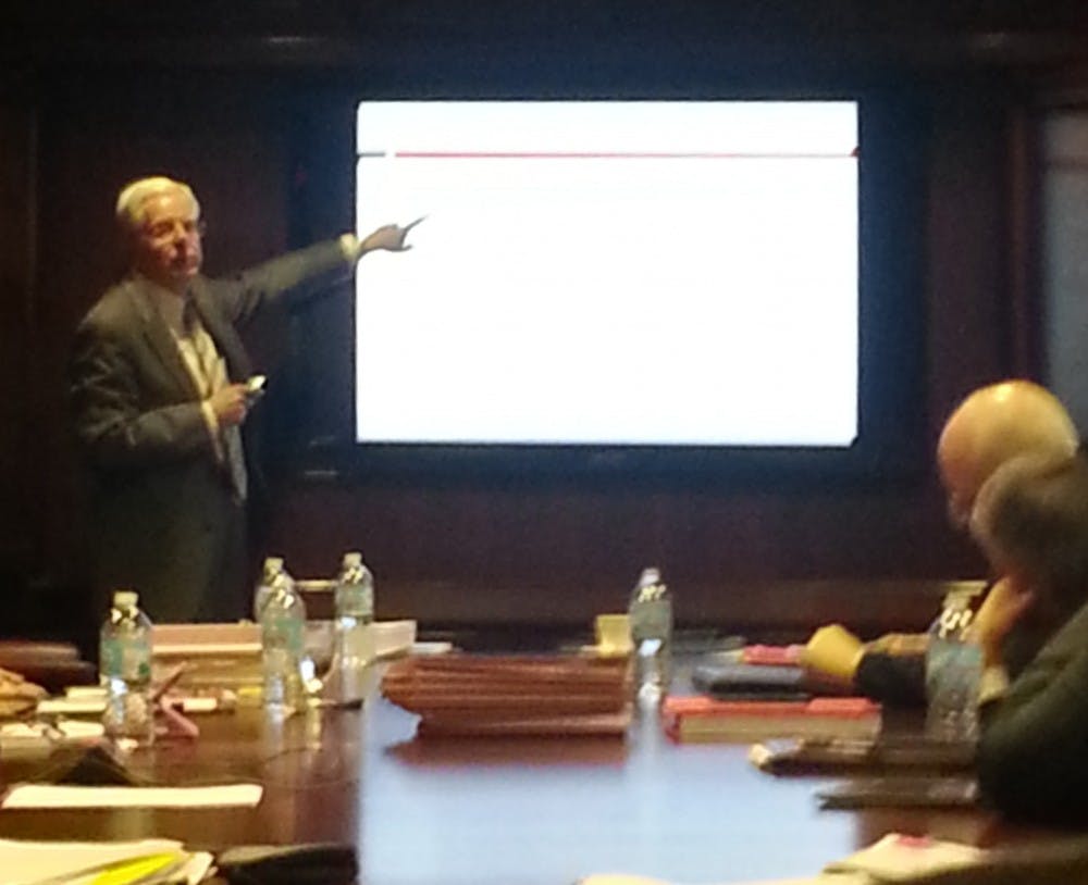 Ball State President Paul Ferguson talks to the board of trustees Friday about awards the university has received for its programs in 2014. Friday's meeting was the last time the trustees will convene for the fall 2014 semester. DN PHOTO ARIC CHOKEY