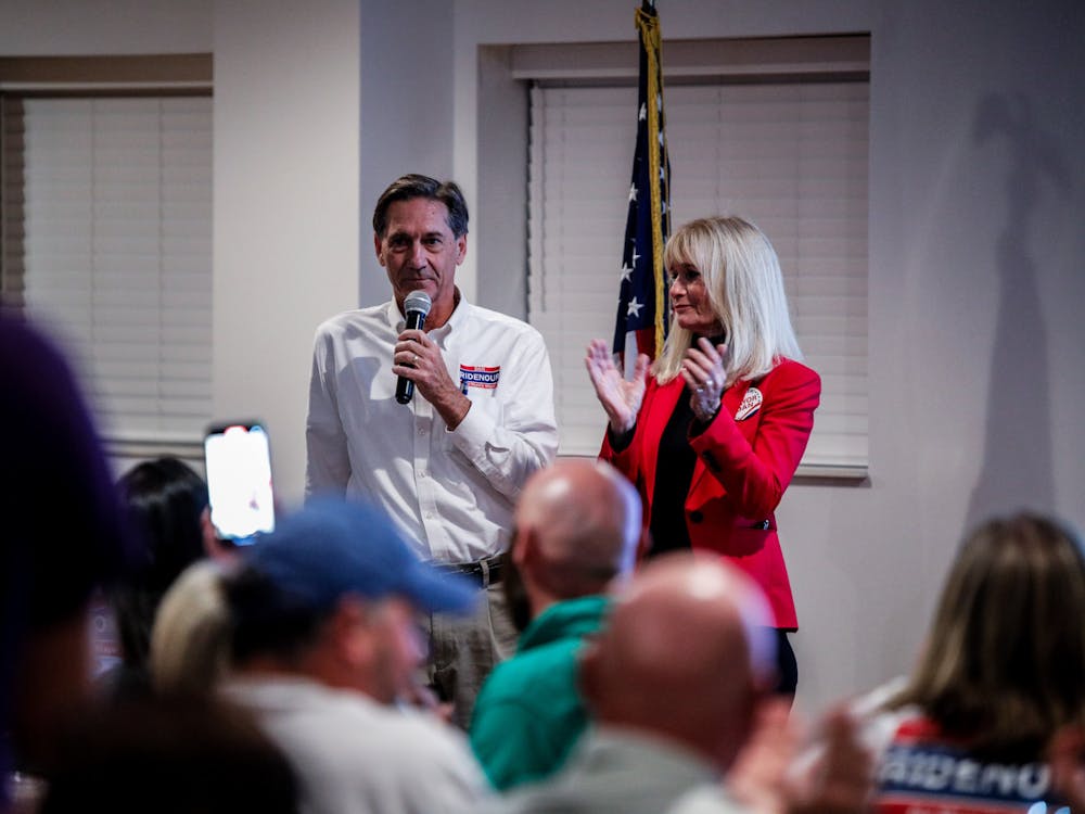 Incumbent Republican Mayor Dan Ridenour speaks to a crowd at Republican Headquarters with his wife, Sherri, Nov. 7, 2023. Ridenour beat Democratic candidate and former City Council President Jeff Robinson. Andrew Berger, DN