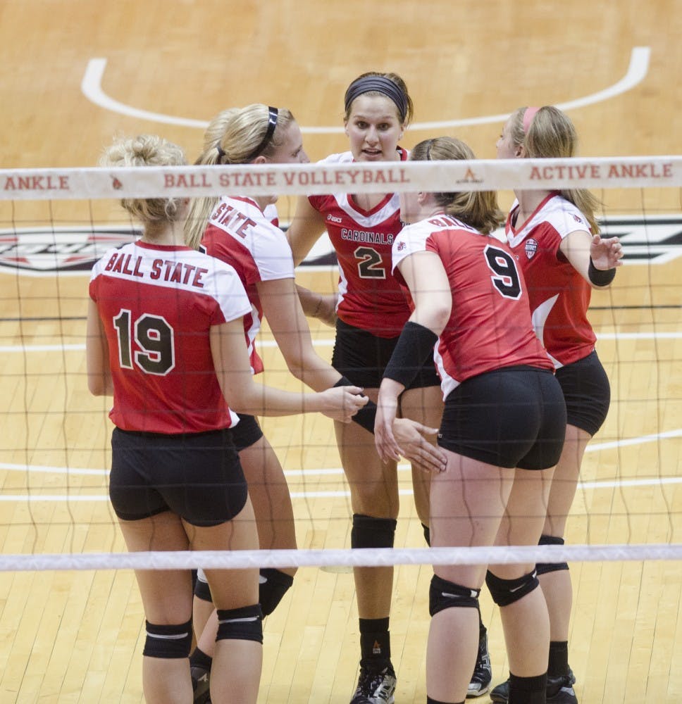 The women's volleyball team high fives during the scrimmage against Purdue University on March 29 at Worthen Arena. DN PHOTO BREANNA DAUGHERTY 