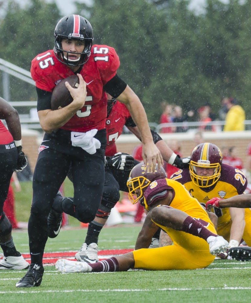Freshman quarterback Riley Neal attempts to run the ball down the field during the game against Central Michigan on Oct. 24 at Scheumann Stadium. DN PHOTO BREANNA DAUGHERTY