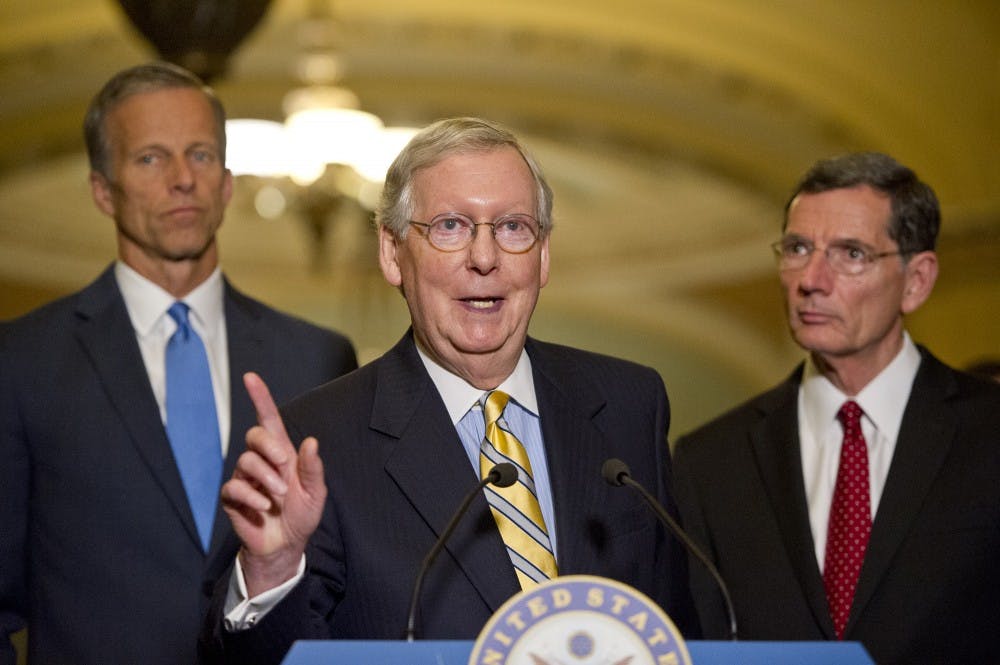 Senate Majority Leader Mitch McConnell (R-Ky.) speaks to reporters following the Republican Party luncheon in the United States Capitol in Washington, D.C., on June 27, 2017. He's flanked by John Barrasso (R-Wyo.), left, and Sen. John Thune (R-SD). (Ron Sachs/CNP/Sipa USA/TNS)