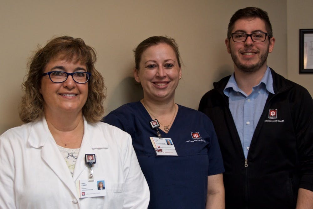Dr. Linda Camp (left) and office staff at IU Health Ball Memorial Cosmetic &amp; Reconstructive Surgery stand in Dr. Camp's office Aug. 17. &nbsp;Camp has traveled ten times over the course of 13 years to Honduras and provides medical services. Mary Freda, DN