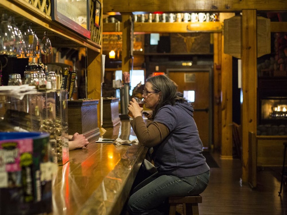 The Heorot Pub and Draught House in downtown Muncie sits quietly with a few customers and a bartender serving a wide selection of craft beer to the Muncie residents April 4. Grace Hollars, DN