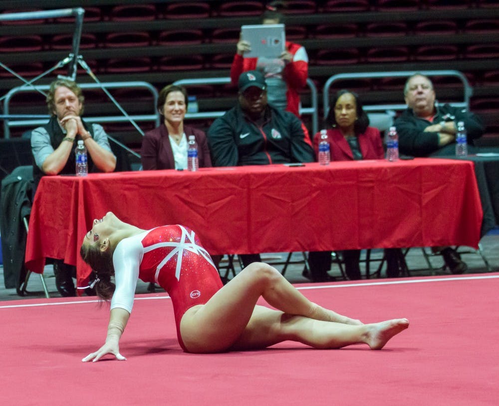 <p>Special guests watch Ball State gymnasts perform their floor routine during the Red vs. White meet on Dec. 4 in John E. Worthen Arena. The special guests decided which team won the meet. Teri Lightning Jr., DN</p>