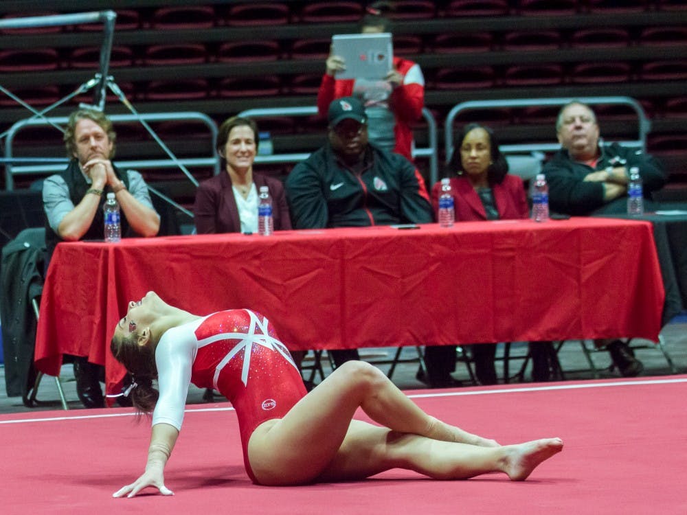 Special guests watch Ball State gymnasts perform their floor routine during the Red vs. White meet on Dec. 4 in John E. Worthen Arena. The special guests decided which team won the meet. Terence K. Lightning Jr., DN.