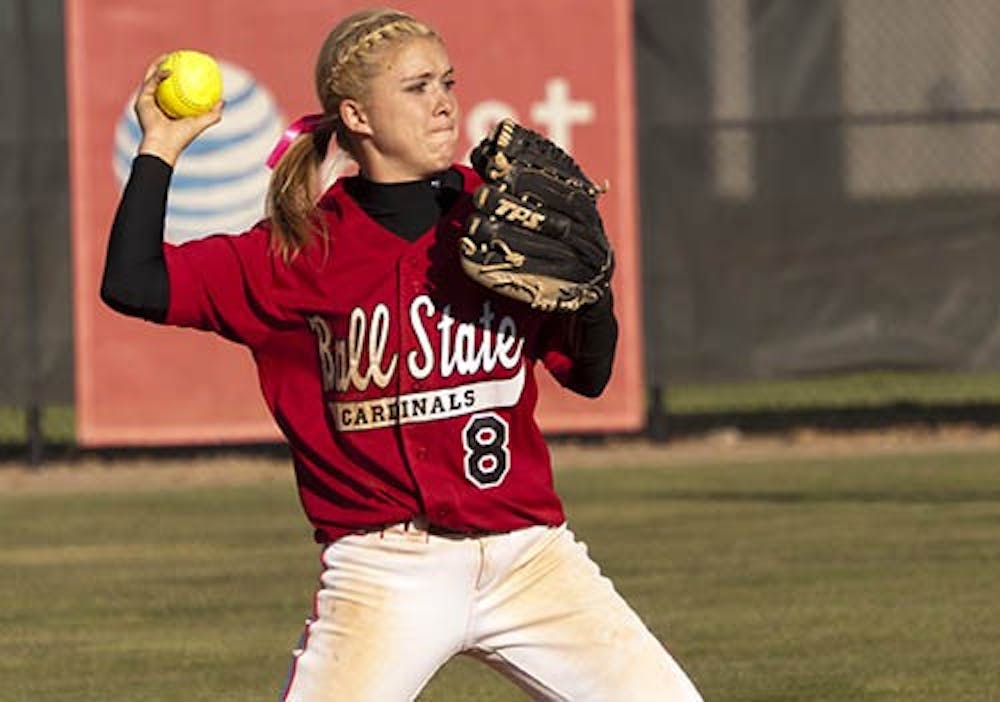 Taylor Cox throws the ball to first Apr. 12, 2012 against Purdue. Cox won player of the week along with freshman pitcher Nicole Steinbach. DN FILE PHOTO DYLAN BUELL