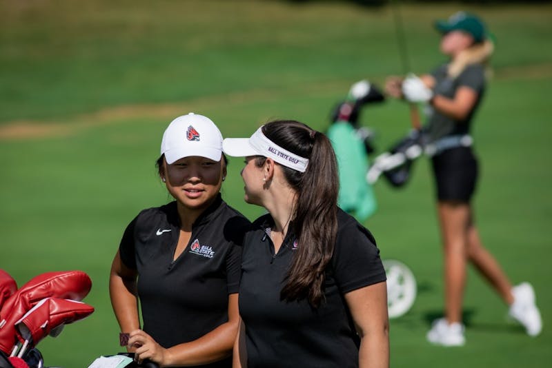 Junior Liz Kim speaks with women’s golf graduate assistant Marie Donnici Sept. 16, 2019, at the Players Club at Woodland Trails in Yorktown, Ind while on the back nine. Kim finished the third round four strokes above par in the Cardinal Classic. Eric Pritchett, DN