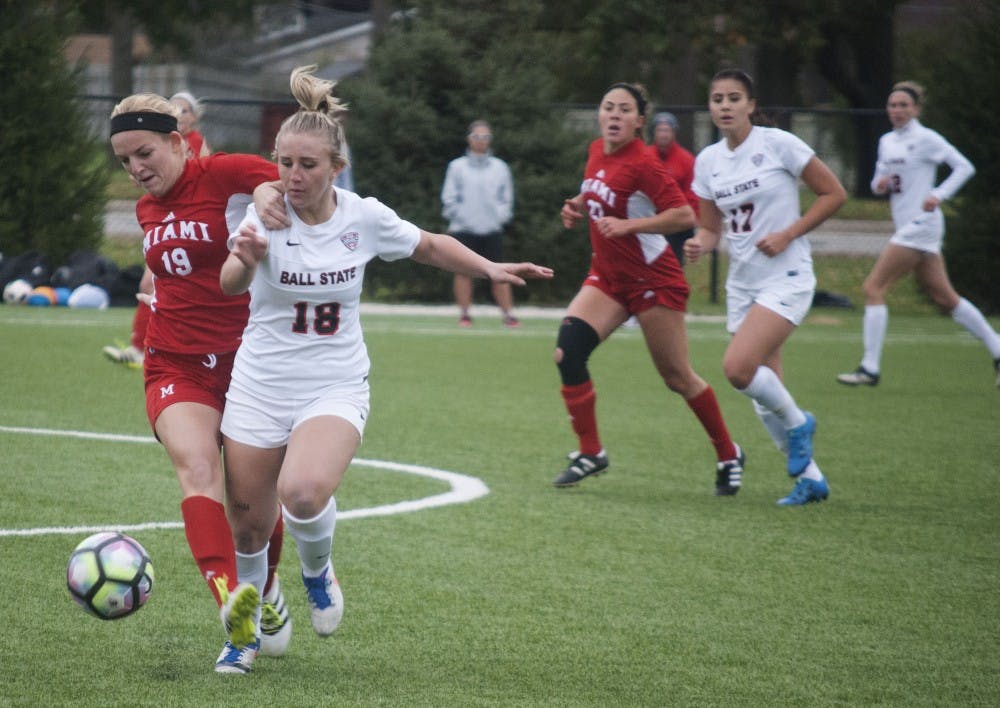<p>Sophomore midfielder/forward Emily Scott fights for the ball against Miami (OH). Ball State won 2-0 and clinched the MAC regular season championship.&nbsp;<em>Colin Grylls // DN&nbsp;</em></p>
