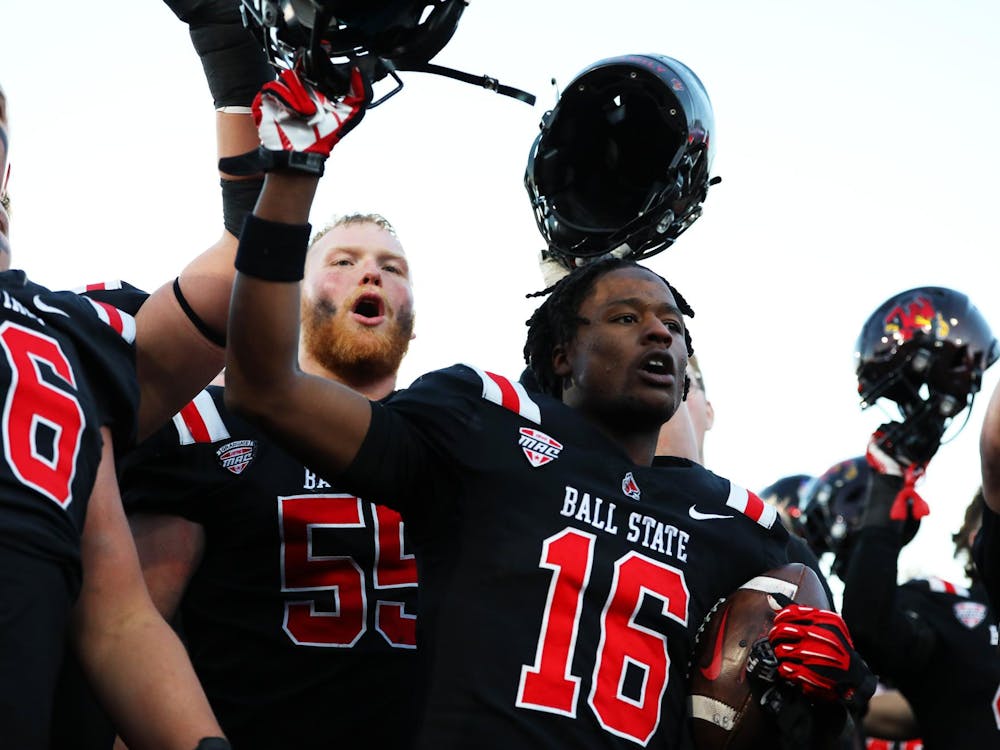 Ball State football celebrates their win over Kent State Nov. 18 at Scheumann Stadium. The Cardinals won 34-3 against the Flashes. Mya Cataline, DN