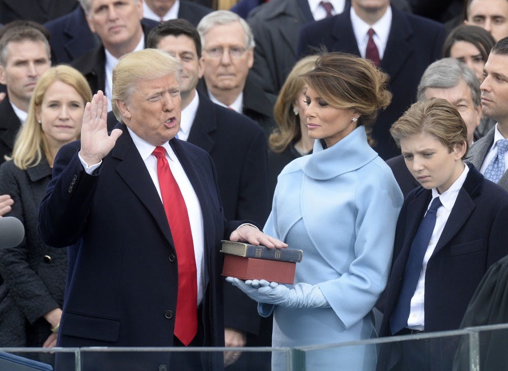 Chief Justice of the United States John G. Roberts, Jr. administers the oath of office to President Donald Trump during the 58th Presidential Inauguration on Jan. 20, 2017 in Washington, D.C. (Olivier Douliery/Abaca Press/TNS) 