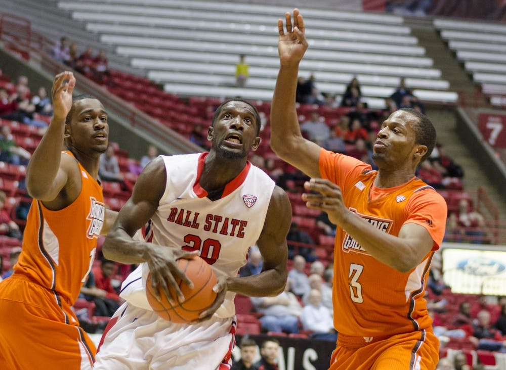 Senior forward Chris Bond gets past two Bowling Green players to get under the basket in the first half Feb. 15 at Worthen Arena. DN PHOTO BREANNA DAUGHERTY 