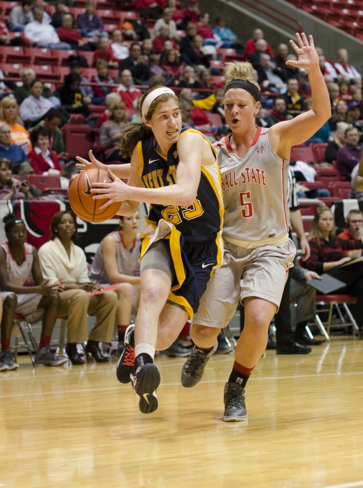 Freshman guard Jill Morrison tries to guard Kent State