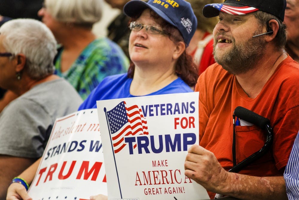 Older Trump supporters found their way to bleachers arranged around the small stage Trump would later appear on April 20. DN PHOTO/TRENT SCROGGINS