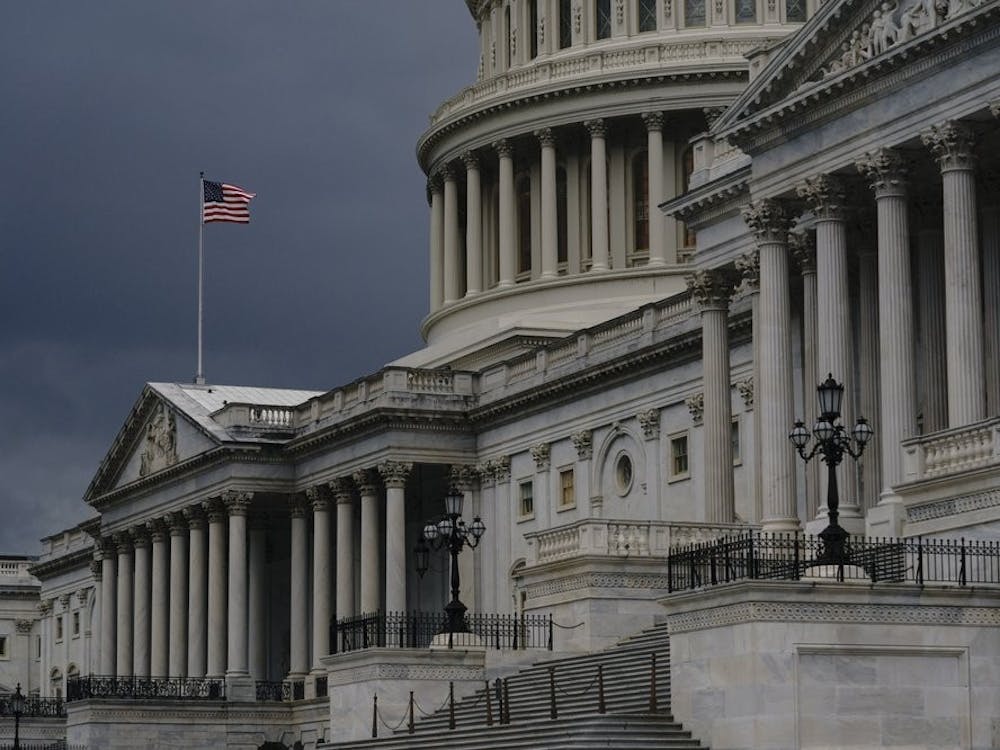 FILE - In this Aug. 3, 2020, file photo dark clouds and heavy rain sweep over the U.S. Capitol in Washington. At least a government shutdown is off the table. But as lawmakers straggle back to Washington for an abbreviated pre-election session, hopes are fading for a pandemic relief bill, or much else. (AP Photo/J. Scott Applewhite, File)