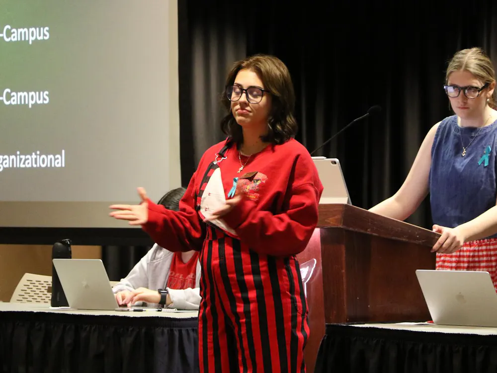 Sen. Addy Morey presents a committee report on behalf of the Student Safety Committee May 1 at the L.A. Pittenger Student Center during a Student Government Association meeting. Landon Jones, DN 
