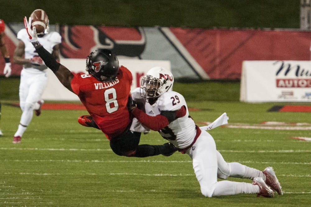 In a nationally televised contest, Ball State and Northern Illinois battled for the Bronze Stalk on Wednesday evening. The Game, which ran into the night, was mostly dominated by NUI's running offense. DN PHOTO JONATHAN MIKSANEK
